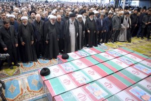 Supreme Leader of Revolution's praying over the body of the martyred president and his companions